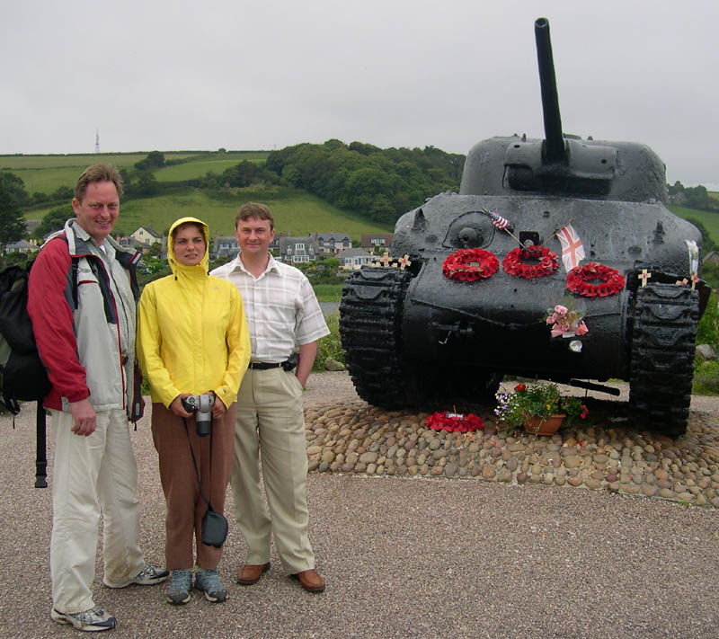 Ukrainian visitors in front of an American tank at the Slapton war memorial in south Devon