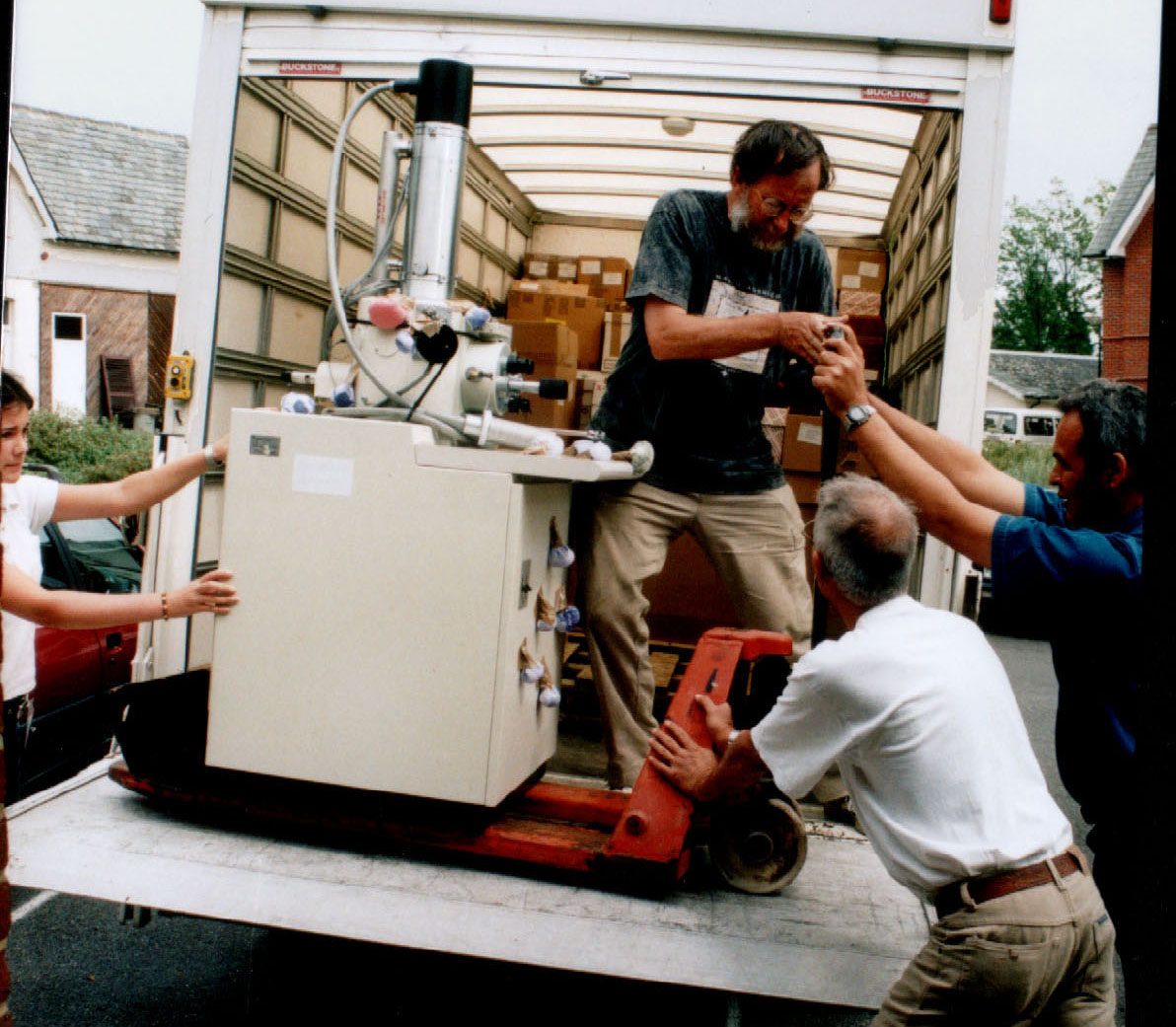 Easy does it: Katherine Copeland, Dave Minter, Miguel Rodríguez Hernández and Julio Mena Portales manoeuvre part of the electron microscope on a truck tail-lift