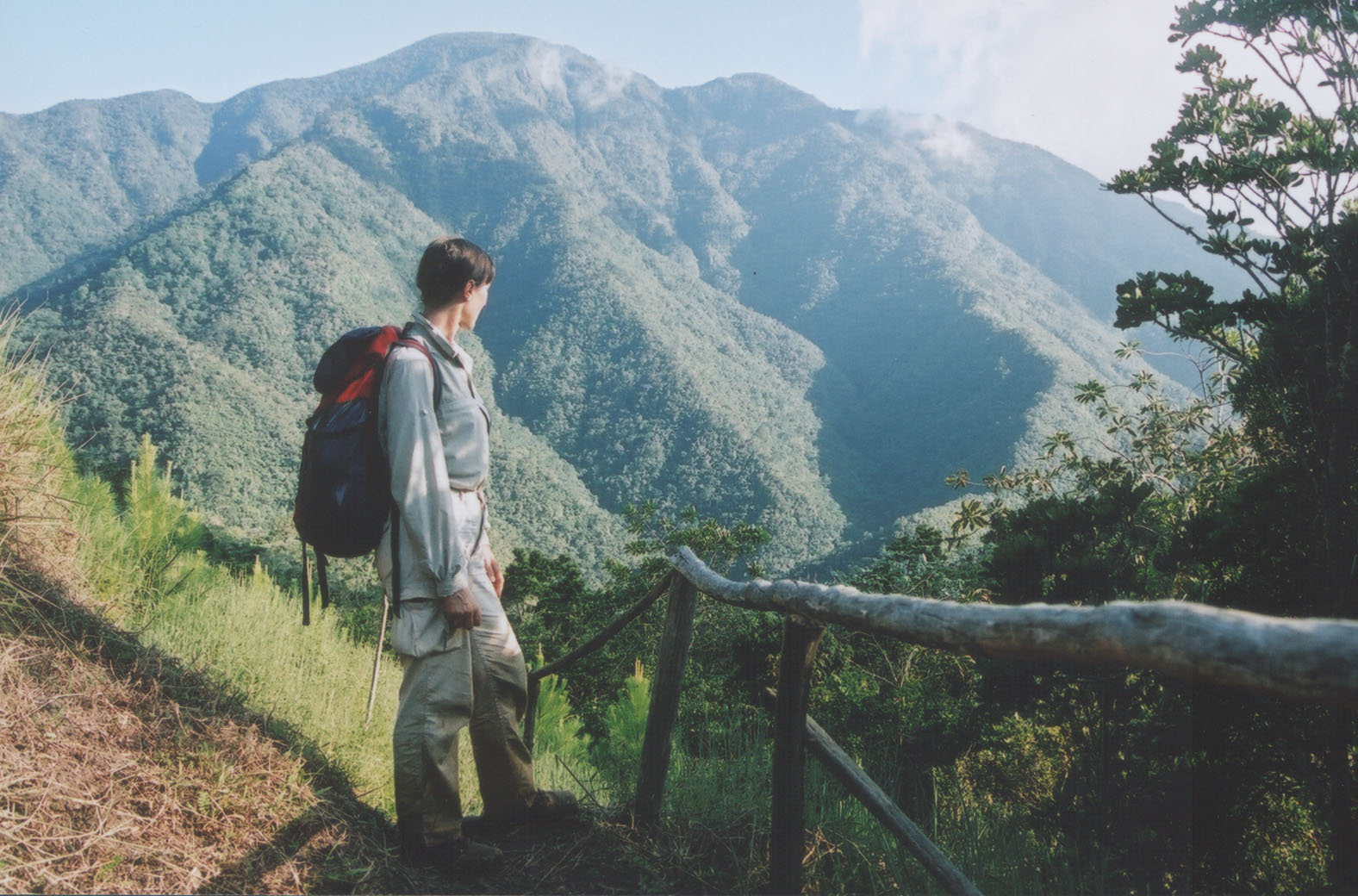 An ecotourist views Pico Turquino, the highest mountain in Cuba