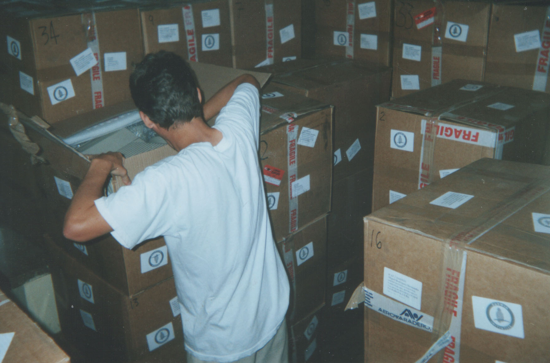 The boxes arrive: opening one of the packs containing desktop computers at the Jardín Botánico Nacional in Havana during the Darwin Initiative project Biodiversity Conservation in Cuba